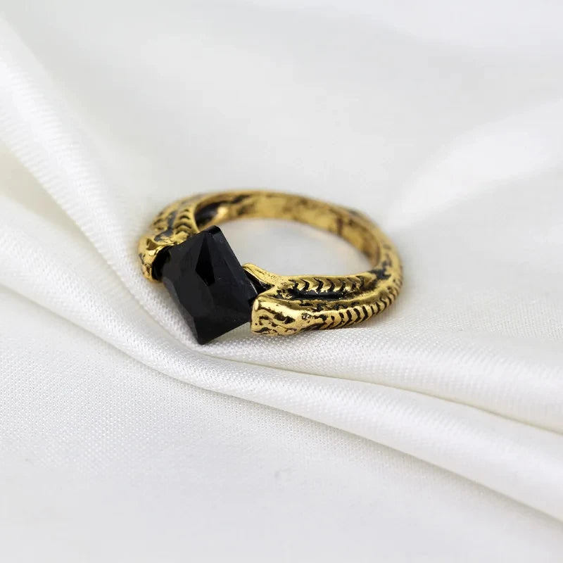 Angled shot of a vintage-style Marvolo Gaunt ring replica with a black gem, ideal for Harry Potter cosplay or jewelry collections.