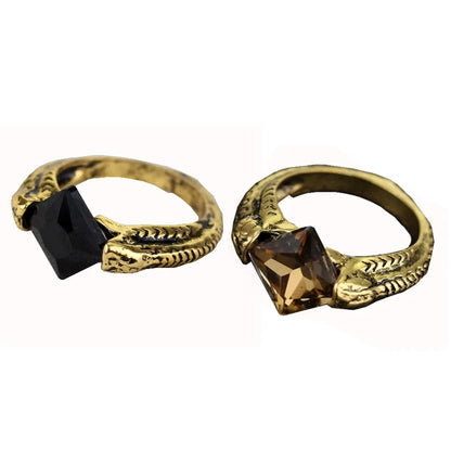 Side-by-side comparison of Harry Potter Horcrux rings with black onyx and transparent brown stone options on a white background.