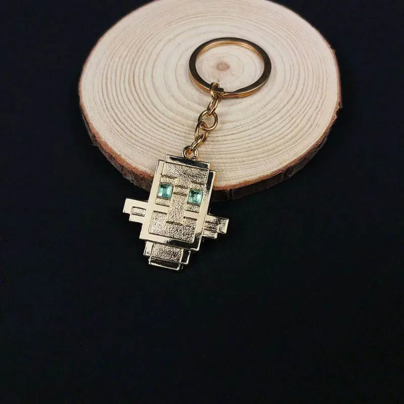 small golden keychain of totem of undying minecraft loot from evoker 