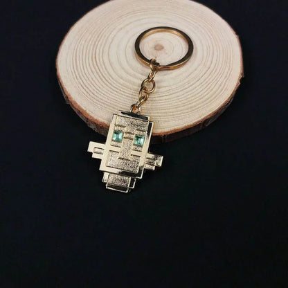 small golden keychain of totem of undying minecraft loot from evoker 